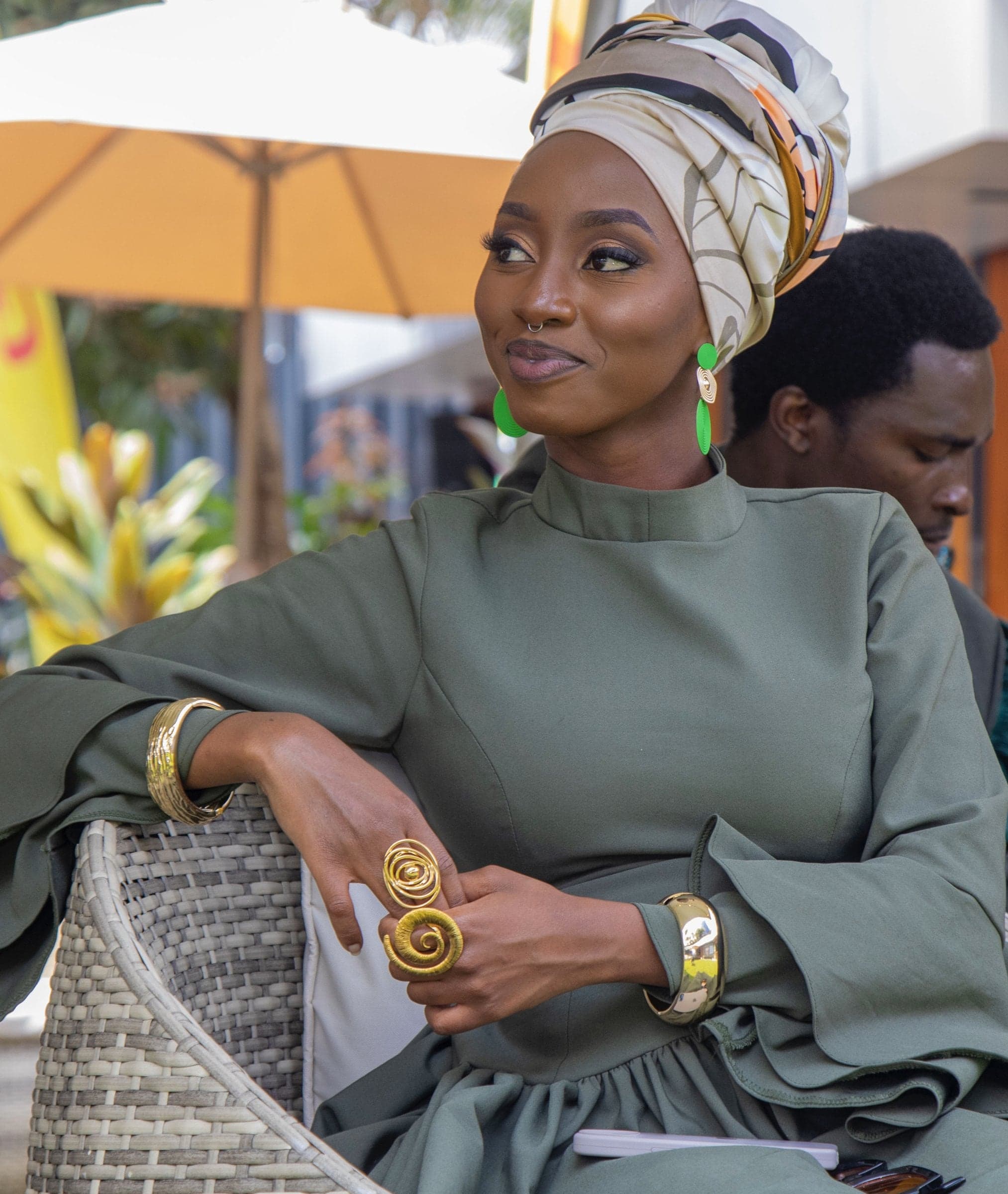 Nyawira Gichuhi smiling in a green midi dress